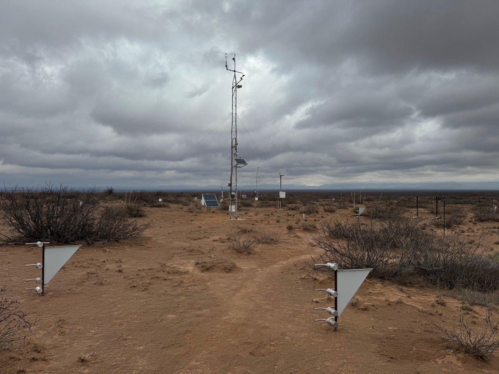 Photo of the Jornada Experimental Range (LTAR) Network site showing meteorological tower MWAC sediment samplers, and rain gauge. Photo of the Jornada Experimental Range (LTAR) Network site showing meteorological tower MWAC sediment samplers, and rain gauge.